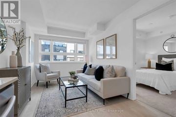 Burlington (Lasalle) townhouse for rent - A living room with a white couch and a coffee table.
