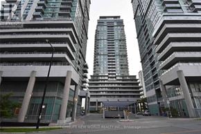 Toronto (Bendale) condo for rent - A tall building with the words "HOMELIFE NEW WORLD REALTY INC." on the side is in the foreground.