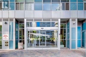 Toronto (Bendale) condo for rent - The front of a building with glass doors and windows.