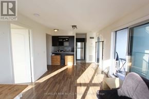 Toronto (Bendale) condo for rent - A modern living room with wooden floors and a large window.