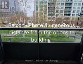 Markham (Unionville) condo for rent - A balcony photo showing a view of a cityscape with a sign that reads "REALTOR".