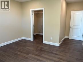 Lasalle apartment for rent - A room with a doorway leading to another room.