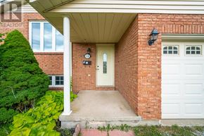 Welland (N. Welland) apartment for rent - A red brick house with a white door and a small porch.