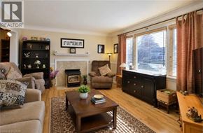 Kitchener apartment for rent - A living room with a fireplace and a coffee table.