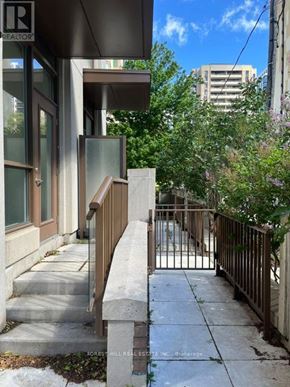 Toronto (Forest Hill South) house for rent - A view of a staircase leading to a door with a glass window.
