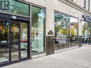 Hamilton (Beasley) condo for rent - The image shows the front of a real estate office with glass doors and windows.