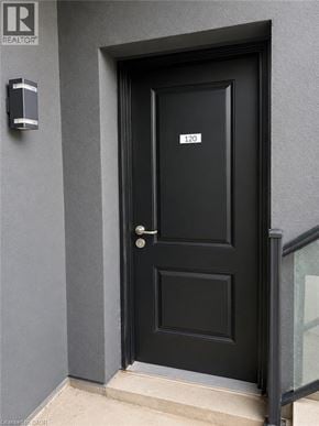 Niagara Falls townhouse for rent - A black door with a number 120 on it.
