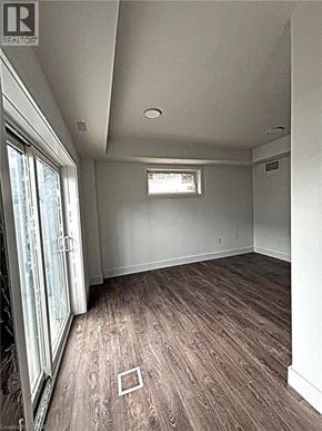 Niagara Falls townhouse for rent - A room with a window and wooden flooring.