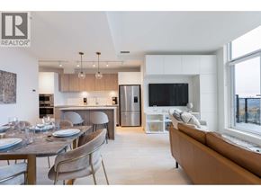 Coquitlam apartment for rent - A modern kitchen with a dining table set for four.