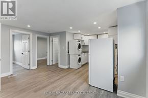Welland (Lincoln/Crowland) apartment for rent - A white refrigerator is in the corner of a room with wood floors and white walls.