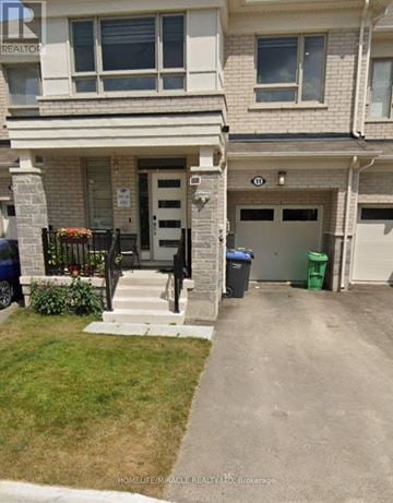 Brampton (Northwest Brampton) townhouse for rent - A house with a front yard and a garage.