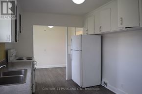 Toronto (L'amoreaux) apartment for rent - A kitchen with a sink, stove and refrigerator.