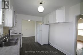 Toronto (L'amoreaux) apartment for rent - A kitchen with white cabinets and a stainless steel sink.