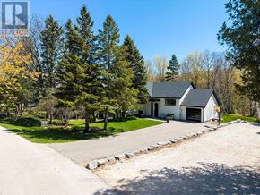 Collingwood apartment for rent - A house with a driveway and trees in the background.