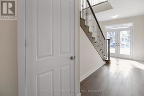 Thorold (Hurricane/Merrittville) apartment for rent - A white door with a black handle is on the left side of the image.