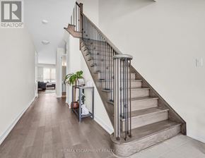 Thorold (Hurricane/Merrittville) apartment for rent - A staircase with a metal railing and wooden steps.