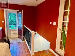 St. Catharines (Vine/Linwell) apartment for rent - A living room with a fireplace and a brown leather couch.