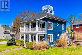 Fort Erie (Lakeshore) apartment for rent - A blue house with a balcony and a small tower on top.