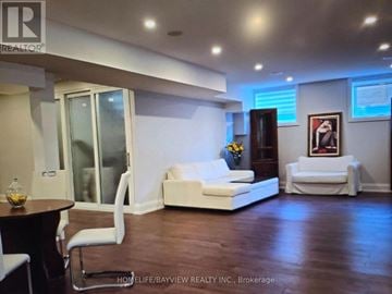 Toronto (Long Branch) apartment for rent - A living room with a white couch and a coffee table.