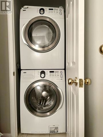 Toronto (Waterfront Communities) townhouse for rent - Two front load washing machines in a small space.