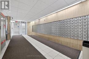 Toronto (Kingsview Village-The Westway) condo for rent - A long hallway with a row of mailboxes on the wall.