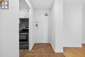 Toronto (Kingsview Village-The Westway) condo for rent - A white door with a gold handle is in a white room.