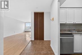 Toronto (Kingsview Village-The Westway) condo for rent - A brown door is in the middle of a white hallway.