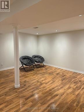 Richmond Hill (Jefferson) apartment for rent - A room with wooden flooring and two chairs.