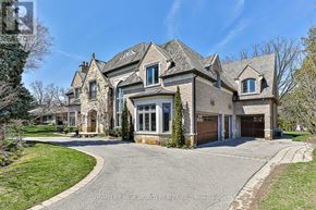 Toronto (Banbury-Don Mills) apartment for rent - A large, luxurious house with a stone facade and multiple windows.