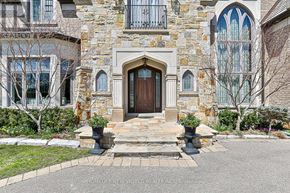 Toronto (Banbury-Don Mills) apartment for rent - A large, beautifully decorated house with a stone facade and a large wooden door.