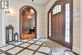 Toronto (Banbury-Don Mills) apartment for rent - A hallway with a checkered floor and a wooden door.