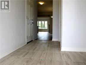 Niagara Falls (Lyons Creek) apartment for rent - A room with a doorway leading to another room.