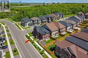Milton (Cb Cobban) apartment for rent - A red car is parked in front of a brick house with a sign that says "REALTOR".