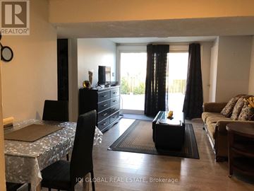 Pickering (Amberlea) apartment for rent - A living room with a dining table and chairs.