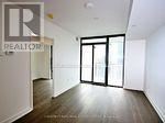 Toronto (Bay Street Corridor) condo for rent - A large empty room with a sliding door.