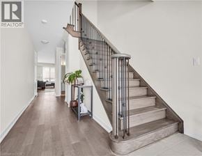 Thorold apartment for rent - A staircase with a metal railing and wooden steps.