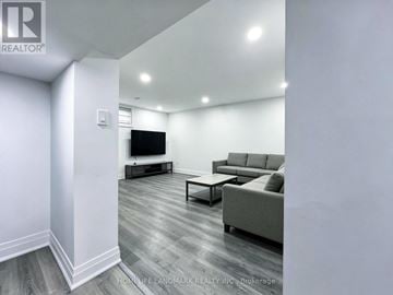 Richmond Hill (Harding) apartment for rent - A living room with a grey couch and a television.