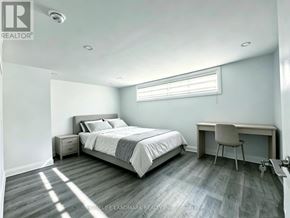 Richmond Hill (Harding) apartment for rent - A bedroom with a bed, desk, and chair.