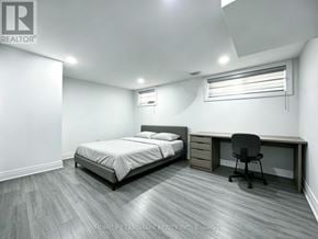 Richmond Hill (Harding) apartment for rent - A bedroom with a bed, desk, and chair.