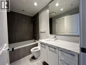 Vancouver apartment for rent - A bathroom with a toilet, sink, and bathtub.