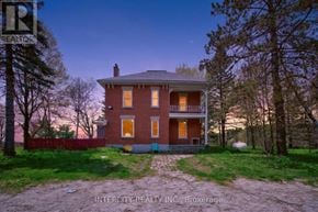 Erin apartment for rent - A house with a red brick exterior and a white porch.