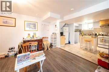 Kitchener apartment for rent - A kitchen with a table and chairs in the middle of the room.