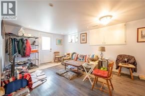 Kitchener apartment for rent - A room with a chair, a table, and a couch.