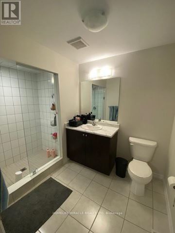 Woolwich townhouse for rent - A bathroom with a toilet, sink, and shower.