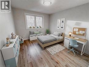Kitchener apartment for rent - A bedroom with a bed, desk, and chair.