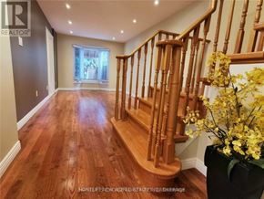 Vaughan (Crestwood-Springfarm-Yorkhill) apartment for rent - A wooden staircase with a flower pot on the landing.