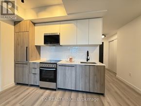 Toronto (Centennial Scarborough) condo for rent - A modern kitchen with wooden cabinets and stainless steel appliances.
