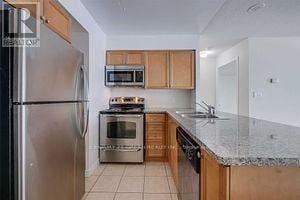 Mississauga (Creditview) condo for rent - A kitchen with a refrigerator, oven, microwave, and sink.