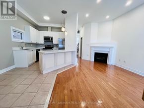 Markham (Cornell) apartment for rent - A spacious kitchen with white cabinets and a wood floor.