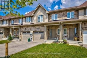 Hamilton (Stoney Creek Mountain) townhouse for rent - A row of houses with a clear blue sky above them.